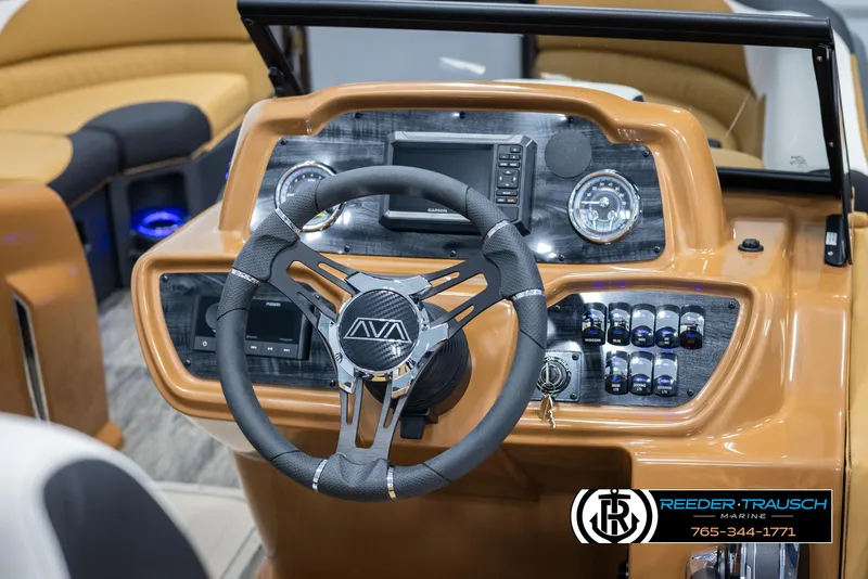 Slide: The Image of 2025 Avalon LSZ VRB boat dashboard with steering wheel and control panel. - 28