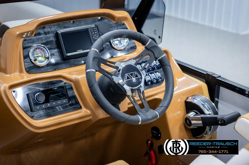 Slide: The Image of 2025 Avalon LSZ VRB boat dashboard with steering wheel and control panel. - 29