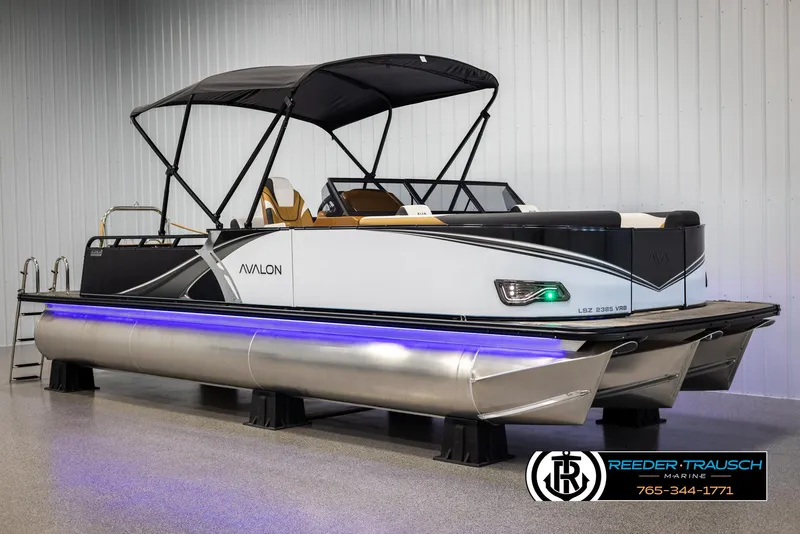 Slide: The Image of 2025 Avalon LSZ VRB pontoon boat with canopy and blue LED lights. - 3