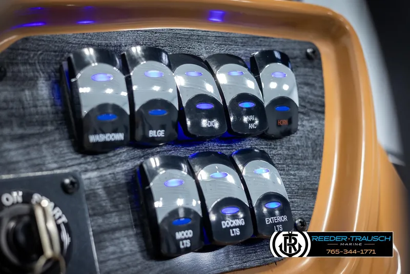Slide: The Image of Control panel of 2025 Avalon LSZ VRB boat with labeled switches. - 35