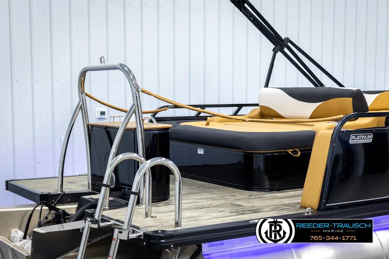 Slide: The Image of 2025 Avalon LSZ VRB pontoon boat with tan seating and stainless steel ladder. - 39