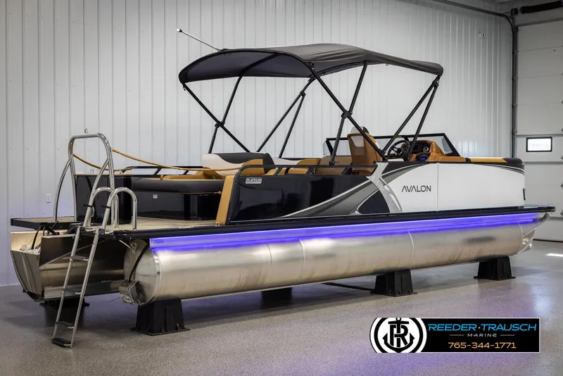 Slide: The Image of 2025 Avalon LSZ VRB pontoon boat with canopy and LED lights in showroom. - 6