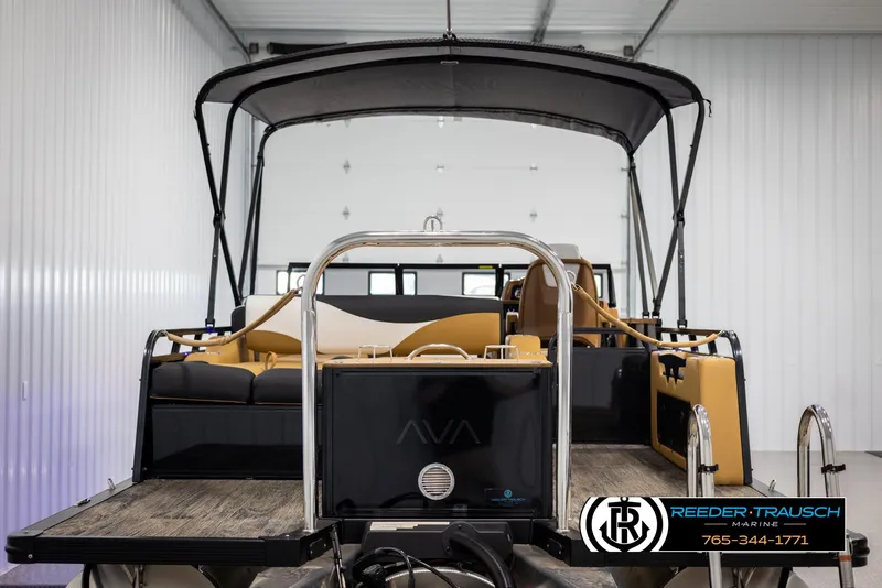 Slide: The Image of 2025 Avalon LSZ VRB boat with canopy in a showroom. - 7