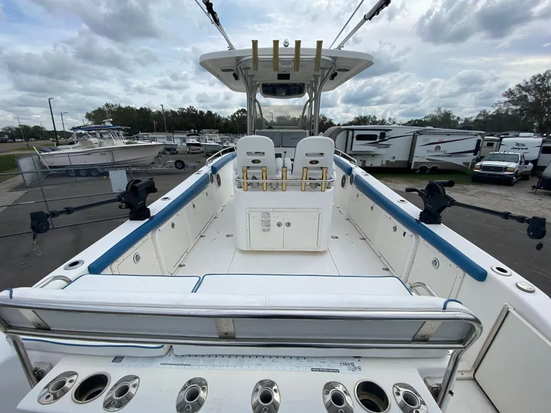 Slide: The Image of 2008 Century 2901 Center Console boat with spacious deck and fishing rod holders. - 32