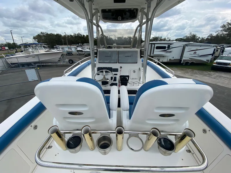 Slide: The Image of 2008 Century 2901 Center Console boat with dual seats and fishing rod holders. - 35