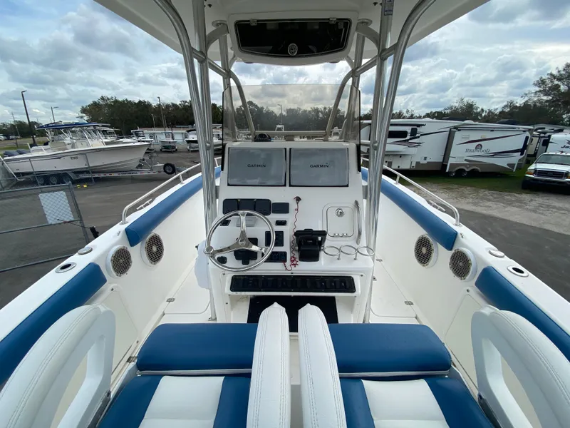 Slide: The Image of 2008 Century 2901 Center Console boat interior with steering wheel and seating. - 36