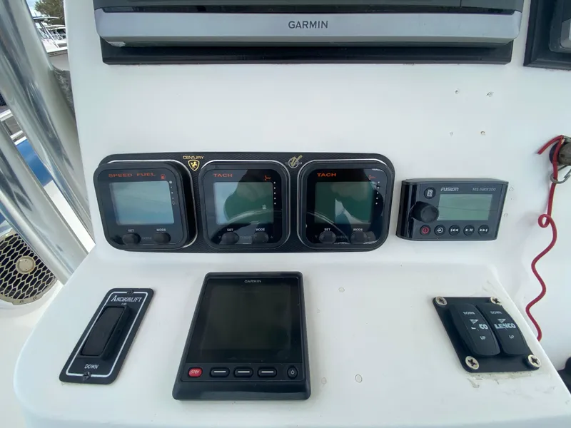 Slide: The Image of Century 2901 Center Console 2008 dashboard with Garmin navigation and control panels. - 40