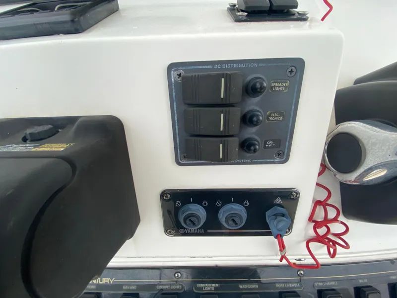 Slide: The Image of Control panel of a 2008 Century 2901 Center Console boat with switches and Yamaha connectors. - 42