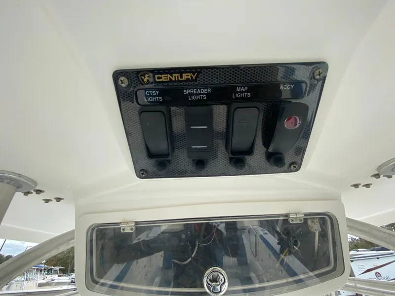 Slide: The Image of Century 2901 Center Console 2008 boat control panel with light switches. - 48