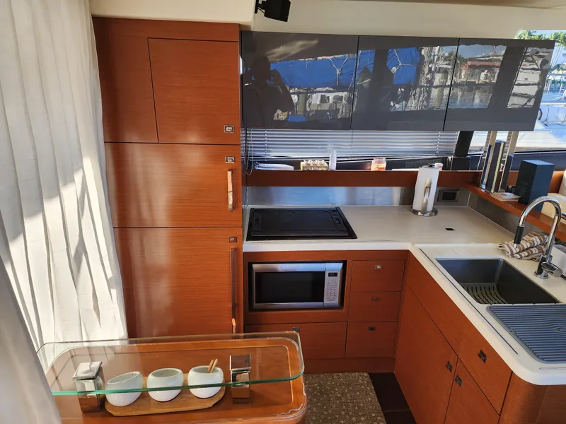 Slide: The Image of Modern kitchen interior of 2014 Prestige 550 yacht with wood cabinetry and appliances. - 16