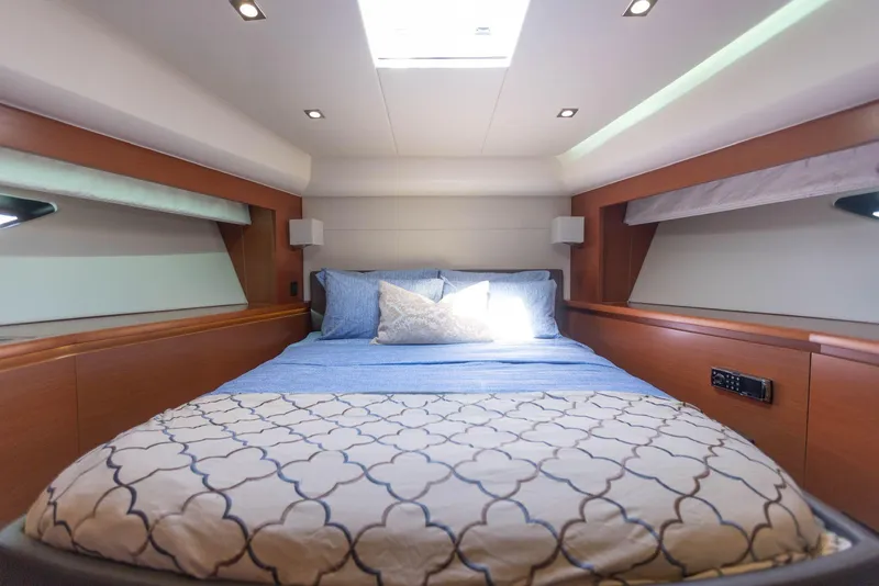 Slide: The Image of Luxurious cabin interior of 2014 Prestige 550 yacht with cozy bed and modern lighting. - 23