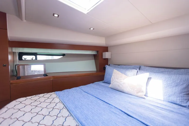 Slide: The Image of Luxurious cabin interior of 2014 Prestige 550 yacht with cozy bedding. - 24