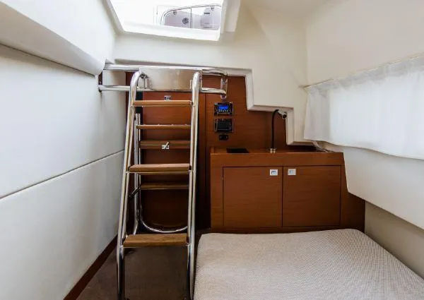 Slide: The Image of Interior cabin of 2014 Prestige 550 yacht with wooden ladder and compact bed. - 38