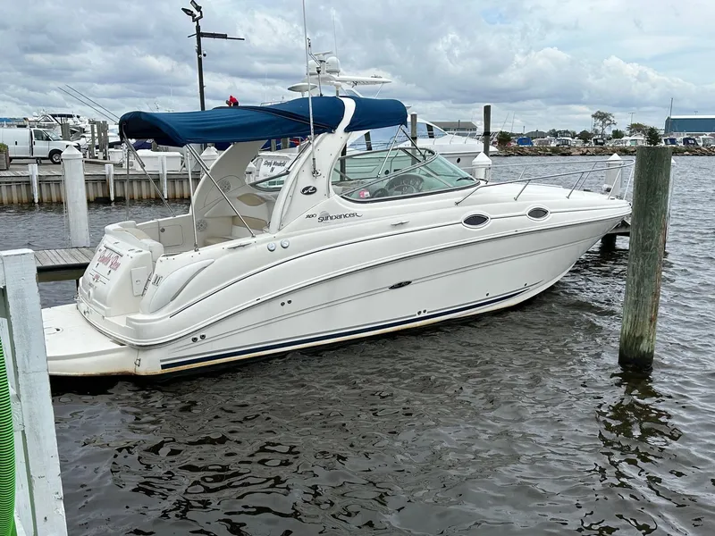 The Image of 2008 Sea Ray 280 Sundancer boat docked at marina with blue canopy. - 0