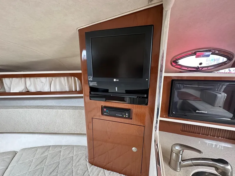 Slide: The Image of Interior of 2008 Sea Ray 280 Sundancer with TV, microwave, and sink. - 11