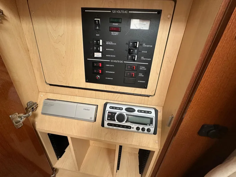 Slide: The Image of Electrical control panel inside 2008 Sea Ray 280 Sundancer boat cabin. - 12