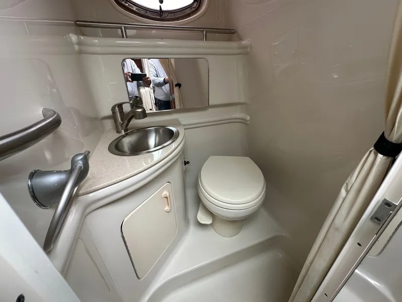 Slide: The Image of 2008 Sea Ray 280 Sundancer bathroom with sink, toilet, and mirror. - 18