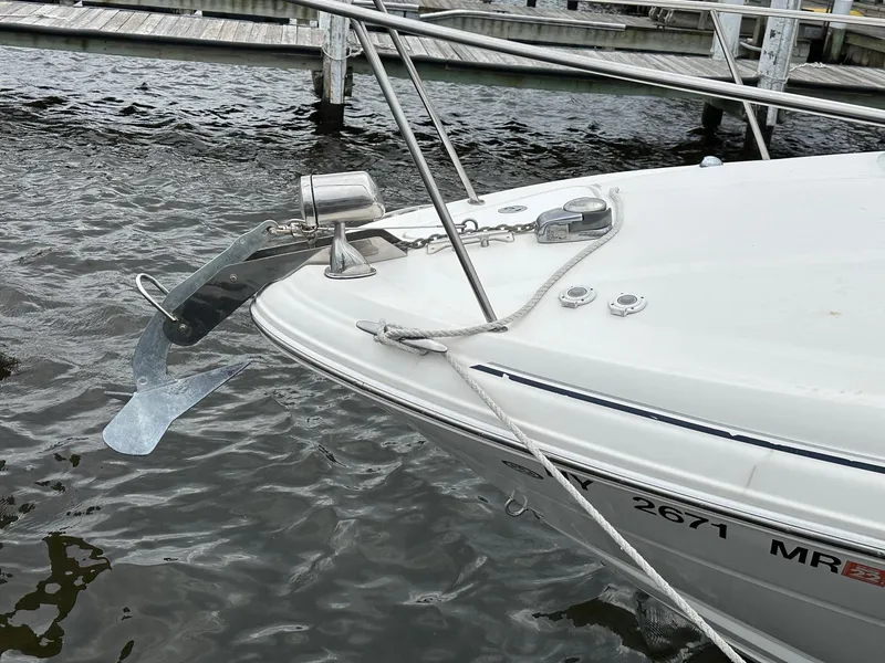 Slide: The Image of Bow of 2008 Sea Ray 280 Sundancer with anchor, docked by wooden pier. - 20
