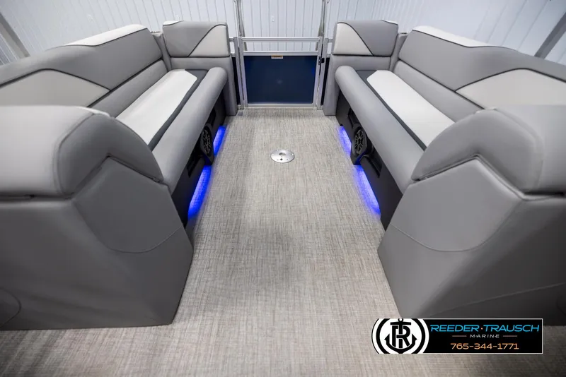 Slide: The Image of Luxurious 2025 Avalon VEN QL boat interior with gray seating and blue LED lighting. - 15
