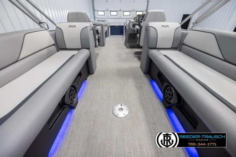Slide: The Image of 2025 Avalon VEN QL boat interior with gray seating and blue LED lighting. - 16