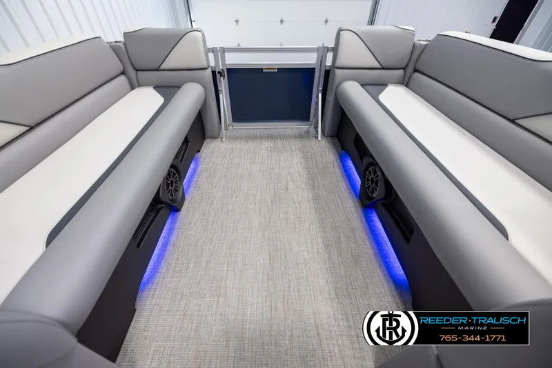 Slide: The Image of 2025 Avalon VEN QL boat interior with gray seating and blue LED lighting. - 18