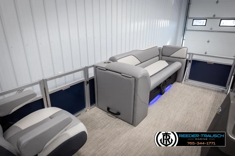 Slide: The Image of 2025 Avalon VEN QL boat interior with gray seating and blue LED lighting. - 20