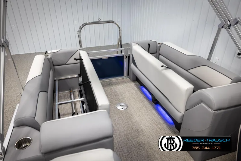 Slide: The Image of Avalon VEN QL 2025 boat interior with gray seating and blue LED lighting. - 24