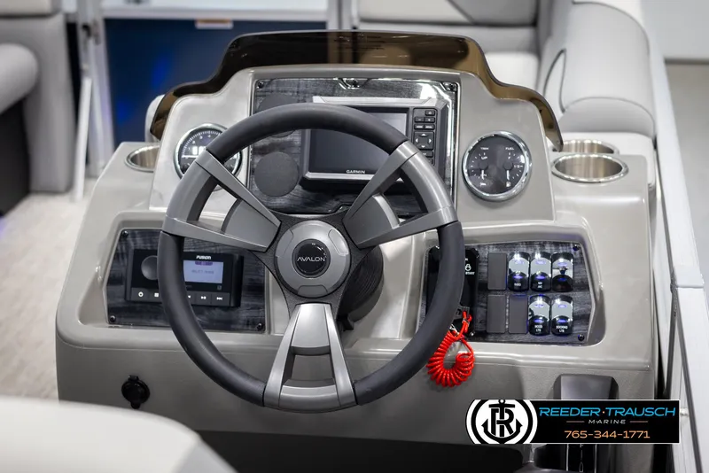 Slide: The Image of 2025 Avalon VEN QL boat dashboard with steering wheel and control panel. - 25