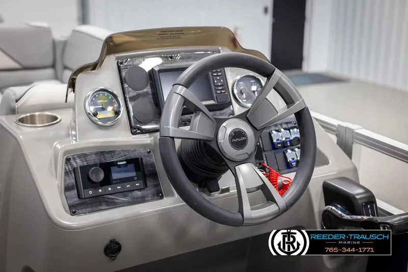 Slide: The Image of 2025 Avalon VEN QL boat dashboard with steering wheel and control panel. - 26