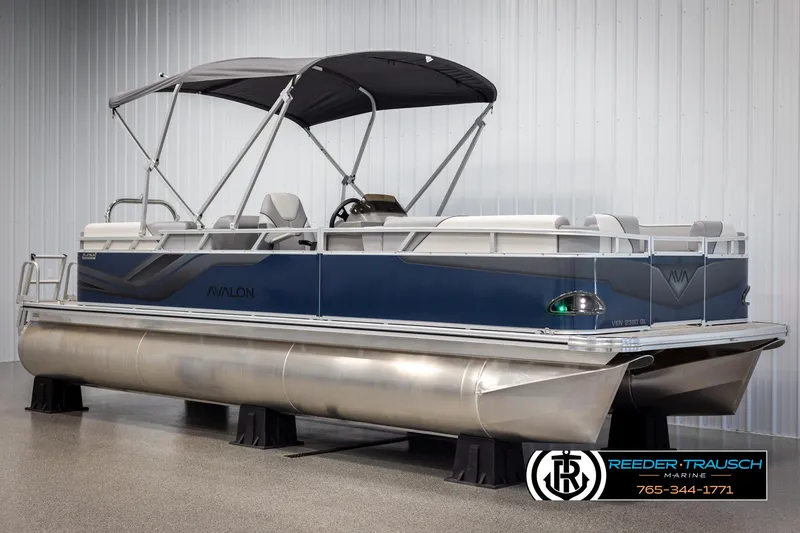 Slide: The Image of 2025 Avalon VEN QL pontoon boat with canopy in showroom. - 3