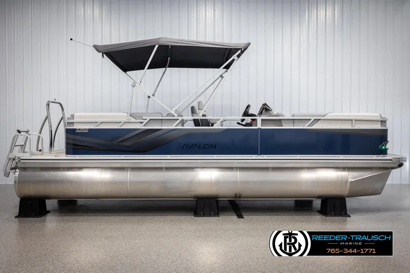 Slide: The Image of 2025 Avalon VEN QL pontoon boat with canopy in showroom. - 6