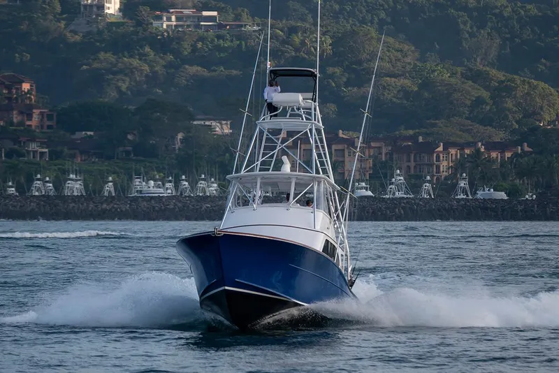 Slide: The Image of 2025 Maverick Yachts Costa Rica 50 cruising on water with scenic coastal backdrop. - 3
