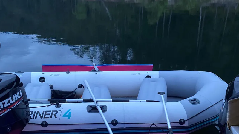 Slide: The Image of Inflatable boat with Suzuki motor on calm water, Great Harbour TT35, 2018 model. - 13