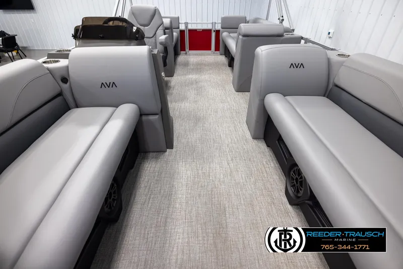 Slide: The Image of 2025 Avalon VLS QL boat interior with gray seating and carpeted flooring. - 13