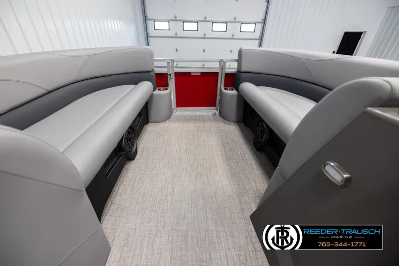 Slide: The Image of 2025 Avalon VLS QL boat interior with gray seating and carpeted floor. - 18