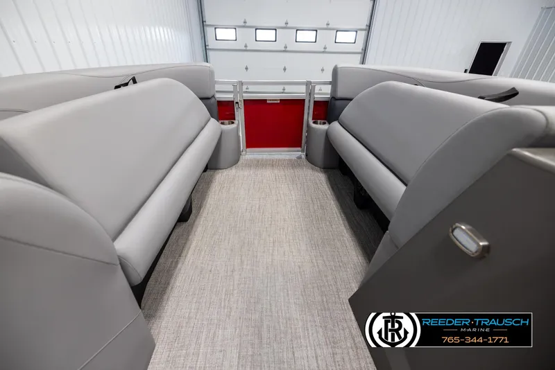 Slide: The Image of Interior of 2025 Avalon VLS QL pontoon boat with gray seating and red accents. - 19