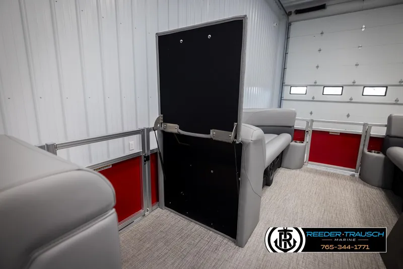 Slide: The Image of 2025 Avalon VLS QL interior with gray seating and red accents in a garage setting. - 21