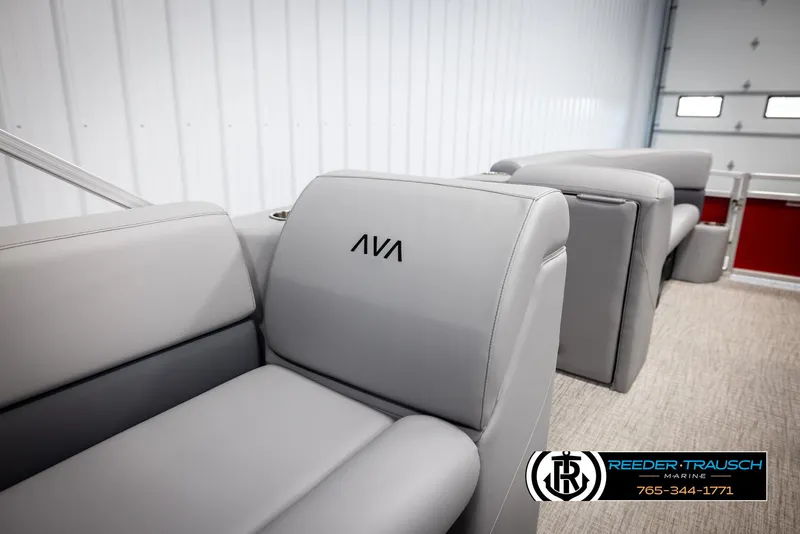 Slide: The Image of Avalon VLS QL 2025 boat interior with gray seating in a showroom. - 22