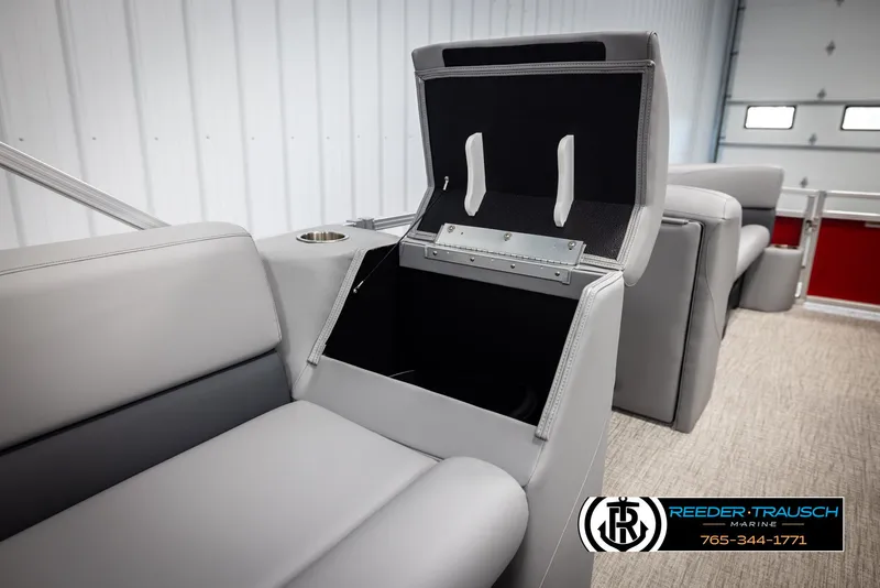 Slide: The Image of 2025 Avalon VLS QL boat interior with open storage compartment and gray seating. - 23