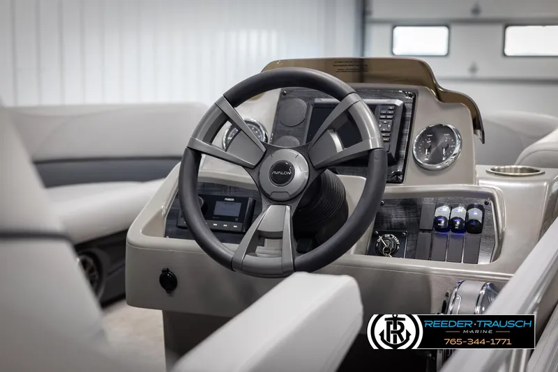 Slide: The Image of 2025 Avalon VLS QL boat dashboard with steering wheel and control panel. - 24