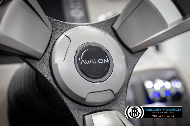 Slide: The Image of Close-up of 2025 Avalon VLS QL steering wheel with logo. - 26