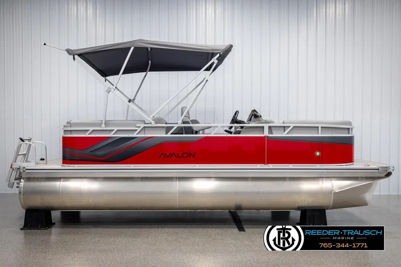 Slide: The Image of 2025 Avalon VLS QL pontoon boat with red and gray design, displayed indoors. - 5