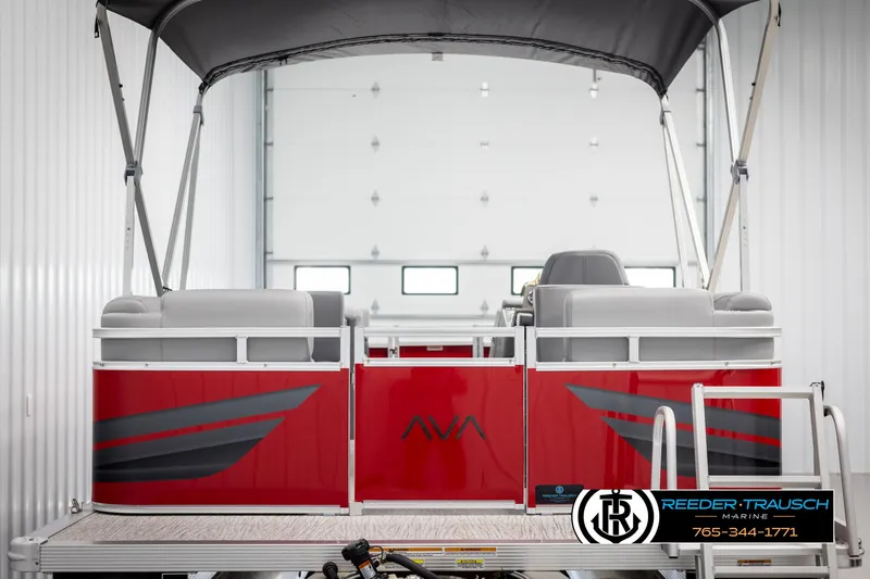 Slide: The Image of 2025 Avalon VLS QL pontoon boat with red and gray design in showroom. - 7