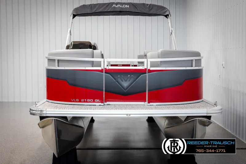 Slide: The Image of 2025 Avalon VLS QL pontoon boat, red and gray design, displayed indoors. - 8