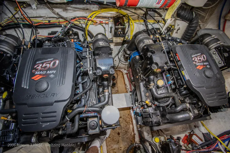 Slide: The Image of 2006 Maxum 3300 SE engine compartment with twin MerCruiser 350 MAG MPI engines. - 22