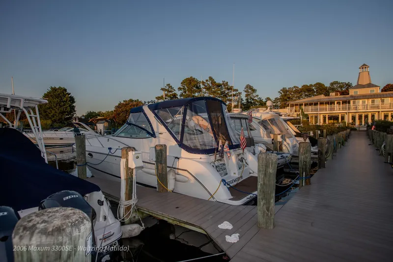 Slide: The Image of 2006 Maxum 3300 SE yacht docked at marina during sunset. - 37