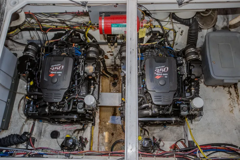 Slide: The Image of 2006 Maxum 3300 SE engine compartment with twin MerCruiser 350 MAG MPI engines. - 44