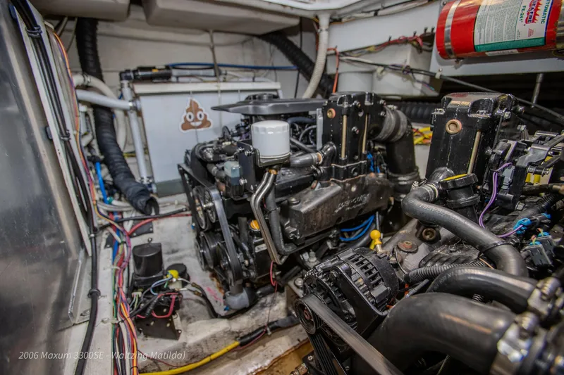 Slide: The Image of Engine room of 2006 Maxum 3300 SE boat with visible wiring and components. - 5