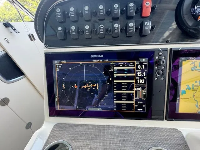 Slide: The Image of Simrad navigation display on 2023 Grady-White Freedom 335 boat dashboard. - 32