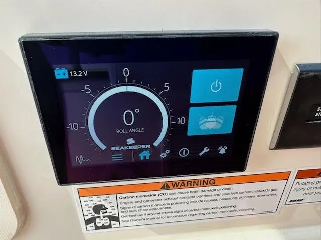 Slide: The Image of Seakeeper control panel on 2023 Grady-White Freedom 335 boat, displaying roll angle and warnings. - 34